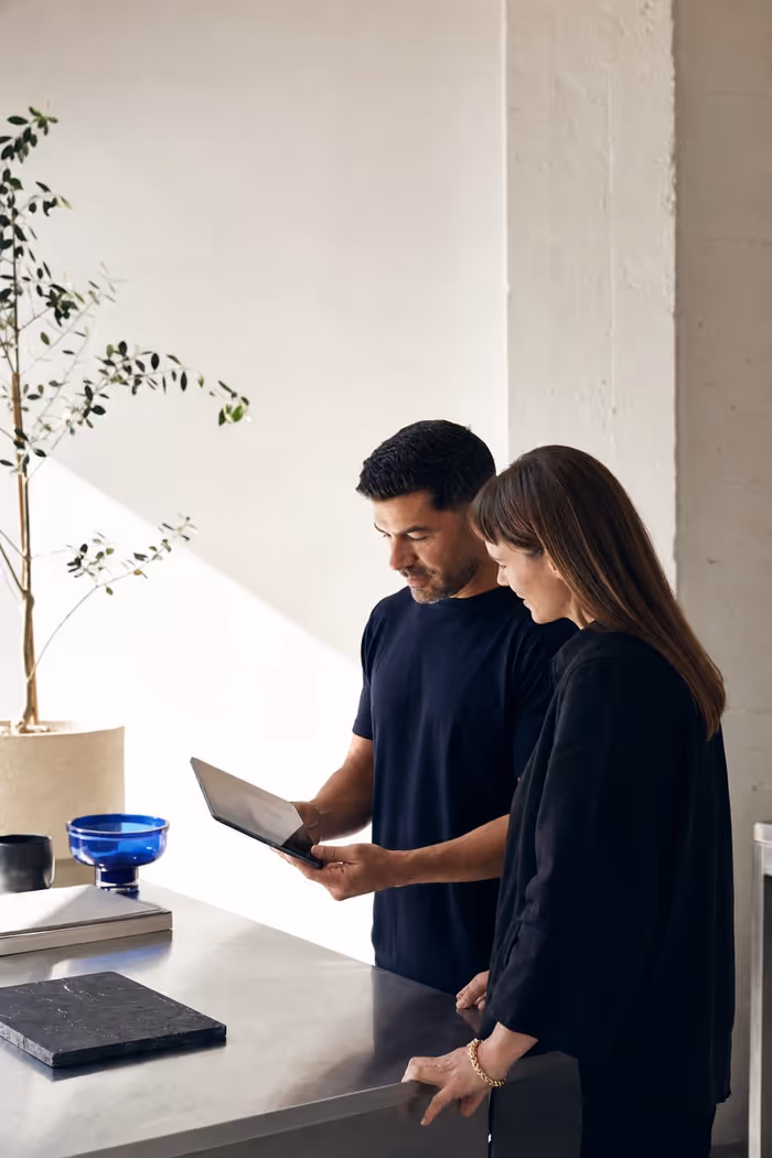 Two collaborators reviewing a digital concept